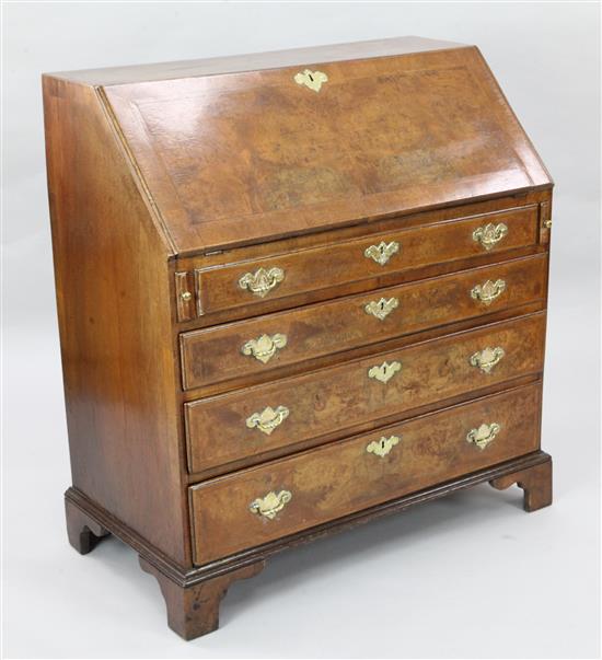 A mid 18th century walnut veneered oak bureau, W.3ft 1in. D.1ft 8in. H.3ft 4in.